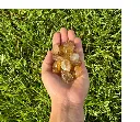 citrine tumbled stone held.webp